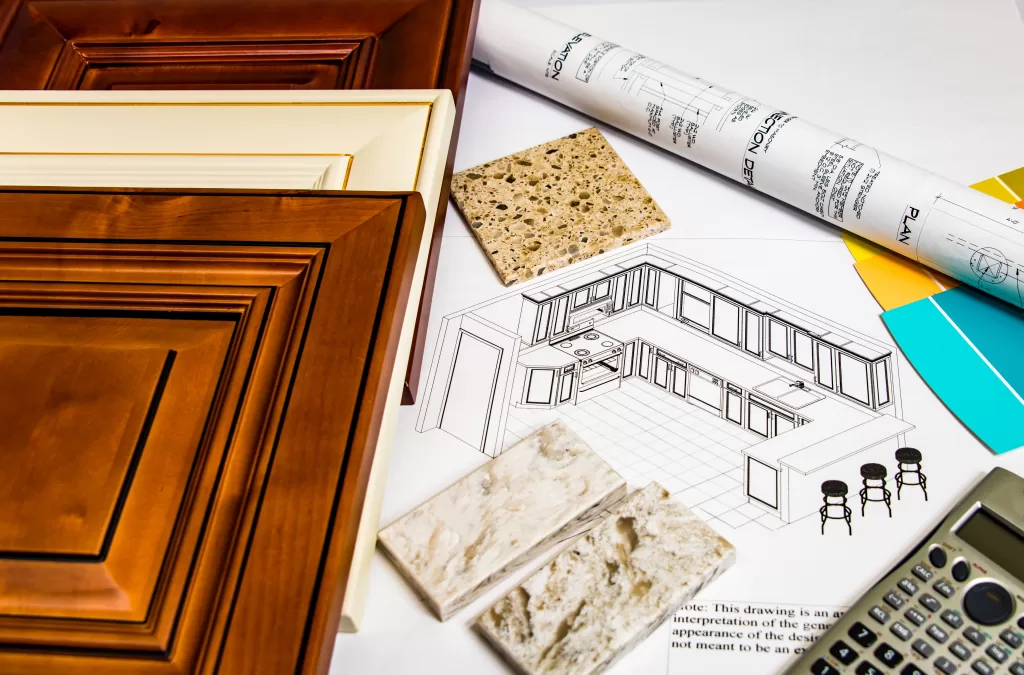 Table with intricate drawings and a meticulously detailed plan, unveiling the grand vision of the forthcoming kitchen renovation