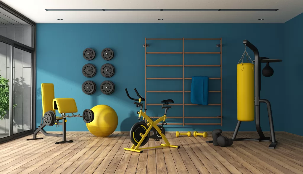 Blue home gym with punching boxer,cyle and other fitness equipment - 3d rendering