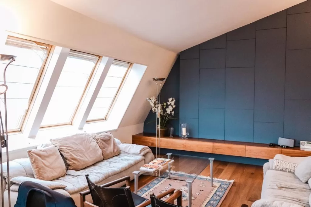 Natural light streams into a cozy room through large vinyl windows