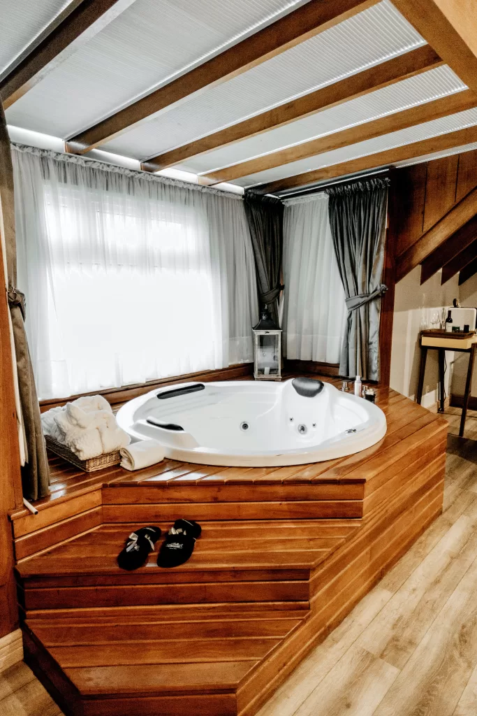Wonderful Jacuzzi bathtub in a wooden bathroom interior