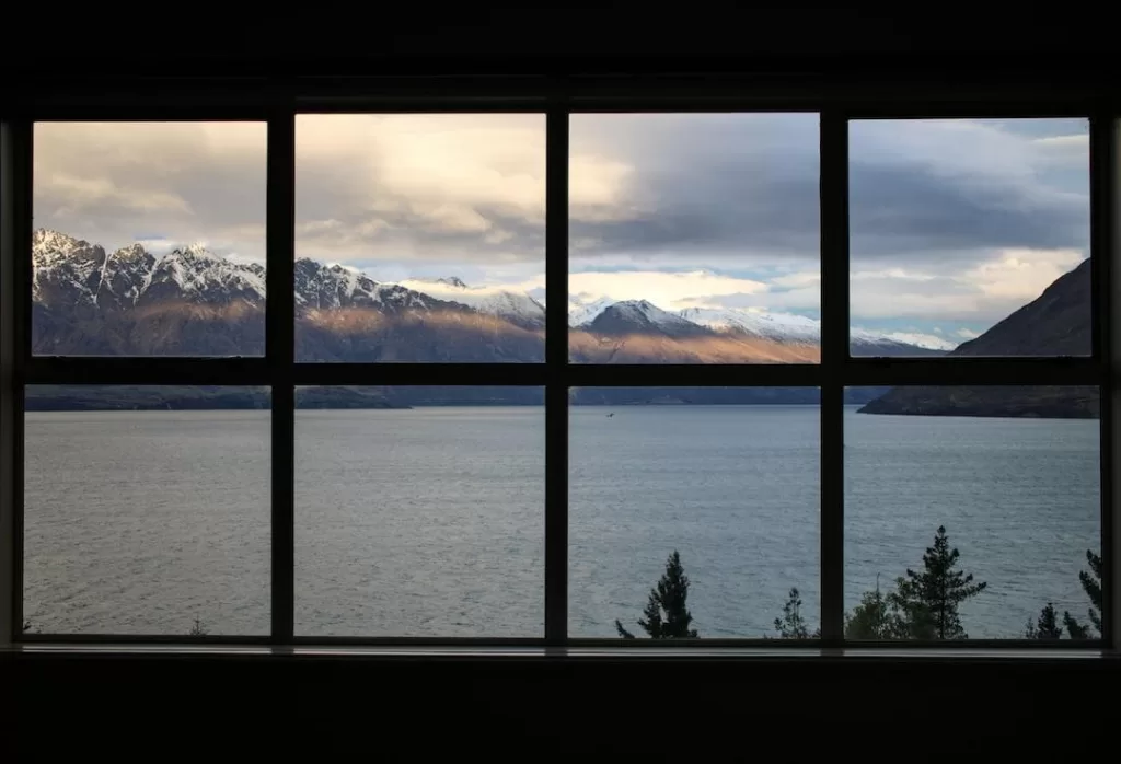 Window with eight glass panes showing a mountain view installed by a local window company