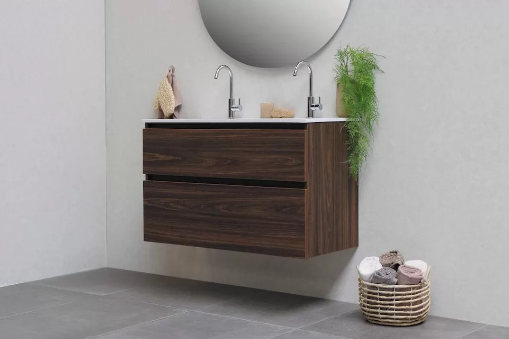 A floating vanity with a towel basket underneath is the centerpiece of a minimalist bathroom.